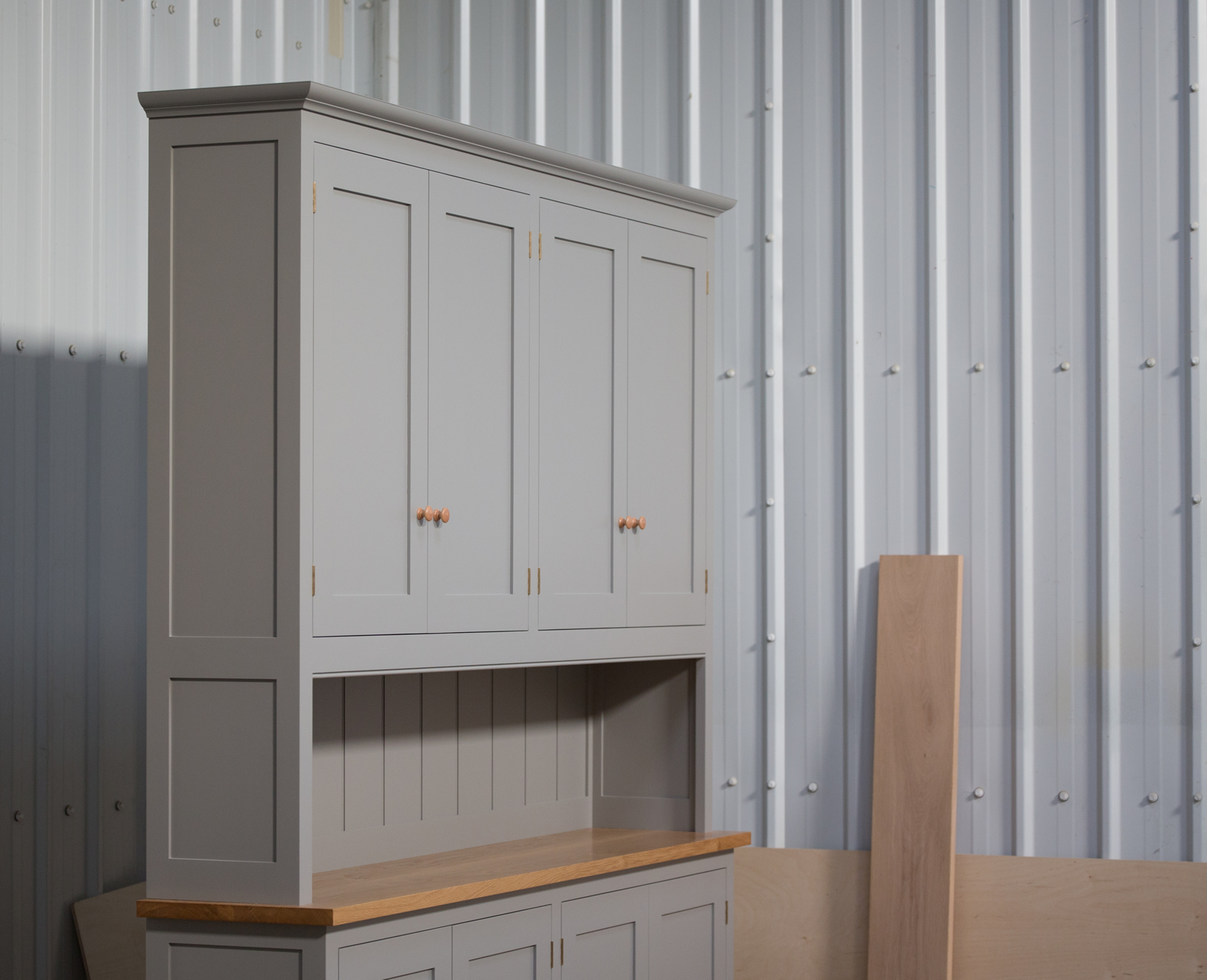 Dresser handpainted in Farrow & Ball Estate Egshell - 'Worsted'. Tulip wood frame with birch ply panels. Oak veneered and lipped birch ply shelves. Hand-turned hardwood knobs. Traditional brass butt hinges with bespoke soft close function. Adjustable 'hidden' levelling feet. Dresser handpainted in Farrow & Ball Estate Egshell - 'Worsted'. Tulip wood frame with birch ply panels. Oak veneered and lipped birch ply shelves. Hand-turned hardwood knobs. Traditional brass butt hinges with bespoke soft close function. Adjustable 'hidden' levelling feet.