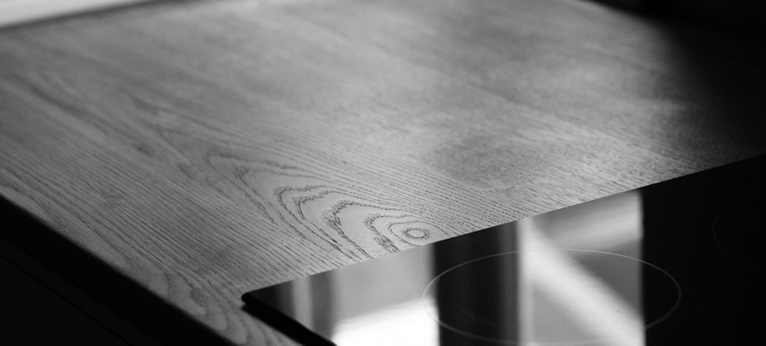 Shaker style kitchen. Birch plywood cabinets with hand painted hardwood frames (Farrow and Ball Estate Eggshell, Pale Powder).Traditional inset sink and integral dishwasher. Inset cooker hob and integral oven. 4.5m full stave oak worktop with upstand. Solid brass hinges and adjustable brass shelf supports. Solid oak dovetailed drawers with painted hardwood fronts. Hand turned beech knobs.