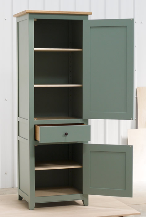 Small larder cupboard handpainted in Farrow and Ball Estate Eggshell - Castle Gray. Solid maple carcass construction with birch ply panels and shelves. Oak dovetailed drawers and oak cornice.